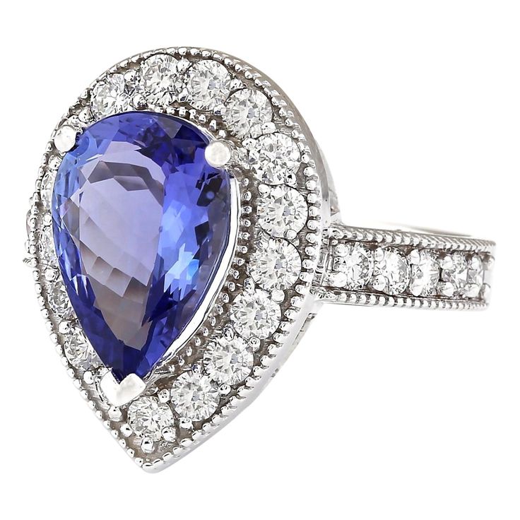 Stamped: 14K White Gold Total Ring Weight: 7.1 Grams Ring Length: N/ARing Width: N/A Gemstone Weight: Total Natural Tanzanite Weight is 3.02 Carat (Measures: 13.20x8.70 mm) Color: Blue Diamond Weight: Total Natural Diamond Weight is 1.10 Carat Quantity: 27 Color: F-G, Clarity: VS2-SI1 Face Measures: 19.25x14.30 mm Sku: [703852W] Formal Sapphire Ring With 17 Jewels In Platinum, Classic Tanzanite Ring For Formal Occasions, White Gold Gemstones With Halo Setting For Formal Events, Formal White Gold Gemstones With Halo Setting, Formal Tanzanite Ring With 17 Jewels, Classic Tanzanite Rings With Brilliant Cut, Formal Tanzanite Fine Jewelry Rings, Tanzanite Brilliant Cut Formal Rings, Elegant Tanzanite Gemstones Gia Certified