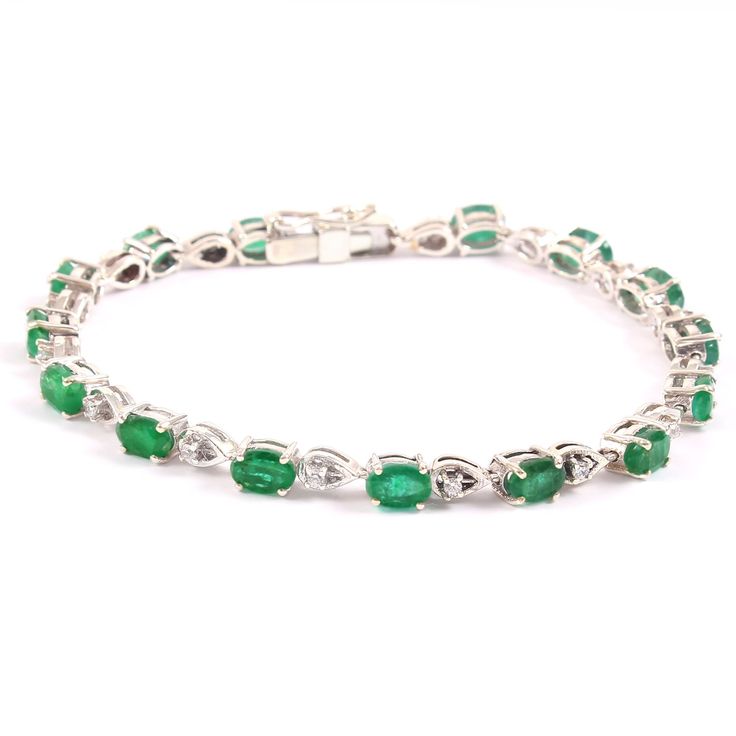 "=> Gemstone Type - Natural Zambian Emerald => Gemstone Weight - Approximately 10 ct => Metal Type - 925 Sterling Silver. => Side Stone - Natural White Topaz => Stone Measurement Available - 6mmx4mmm => Shape - Oval Cut Shape => Bracelet Weight - 13.00 Gram To change the metal to a solid gold (white/rose) or platinum is also available, please ask for a quotation if you want. Emerald Is a May birthstone. Emerald is known as the \"stone of successful love\". It brings loyalty and provides for dome Oval Fine Jewelry Bracelet For Anniversary, Fine Jewelry Tennis Bracelet With Oval Links For Anniversary, Oval Gemstone Bracelets For Anniversary, Classic Green Oval Diamond Bracelet, Silver Oval Tennis Bracelet With Prong Setting, Classic Gemstone Tennis Bracelet For Anniversary, Anniversary Tennis Bracelet With Oval Links, Classic Oval Gemstone Tennis Bracelet, Anniversary Tennis Bracelet With Oval Links In Fine Jewelry