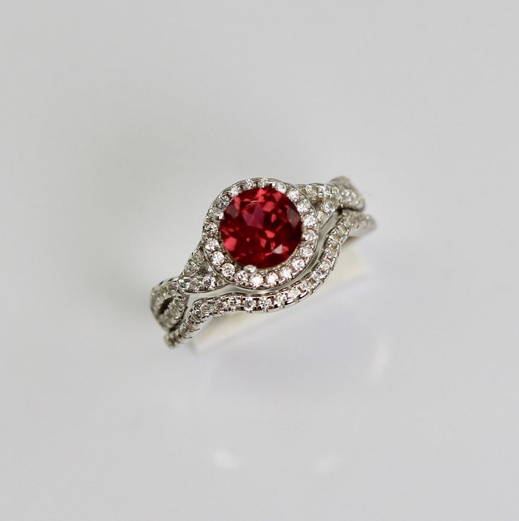 MATERIAL: Sterling Silver .925 MAIN STONE: Type: Simulated Ruby Size: 1ct. (6.5 mm) Shape: Round Cut Color: Purple ADDITIONAL STONES: Stone Type: Diamond Simulants Size: 1-1.5mm(each) Color: D Clarity:si1 Engagement Ring And Band Set, Ring And Band Set, Engagement Ring And Band, Silver Engagement Ring, Sterling Silver Engagement Rings, Diamond Simulant, Silver Engagement Rings, Cut And Color, Ring Verlobung