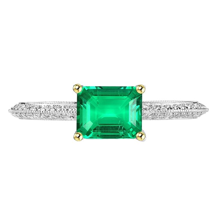 METAL SPECIFICATIONS Two Tone Gold 14K STONE SPECIFICATIONS Stone Name : Green Emerald and Diamond Stone Cut : Emerald and Round Cut Stone Details : There is one emerald cut green emerald stone in the center approx. 2 carats (Approx. Size 8 x 6 mm) with approx. 1.50 carats of small round cut diamonds on the sides. Crafted with natural earth mined stones. Color : Green/F Clarity : VS1 Quality : AAA Total : Approx. 3.50 Carats RING SPECIFICATIONS Size : 6.5 (Can ship in any size) Appraised Value : $10,998.00 Comes with Certificate Green Diamond Cut Diamond Ring, Luxury Green Emerald Ring With Diamond Cut, Emerald Cut Green Jewelry With Pave Setting, Green Diamond Rings With Pave Setting, Gia Certified Green Diamond Ring For Formal Occasions, Green Emerald Ring With Pave Setting As Gift, Gia Certified Green Diamond Ring, Round Cut, Formal Emerald Cut Emerald Ring With Pave Setting, Green Pave Setting Rings For Formal Occasions