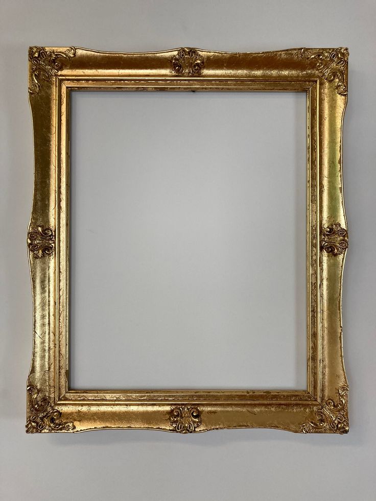 an ornate gold frame hanging on the wall