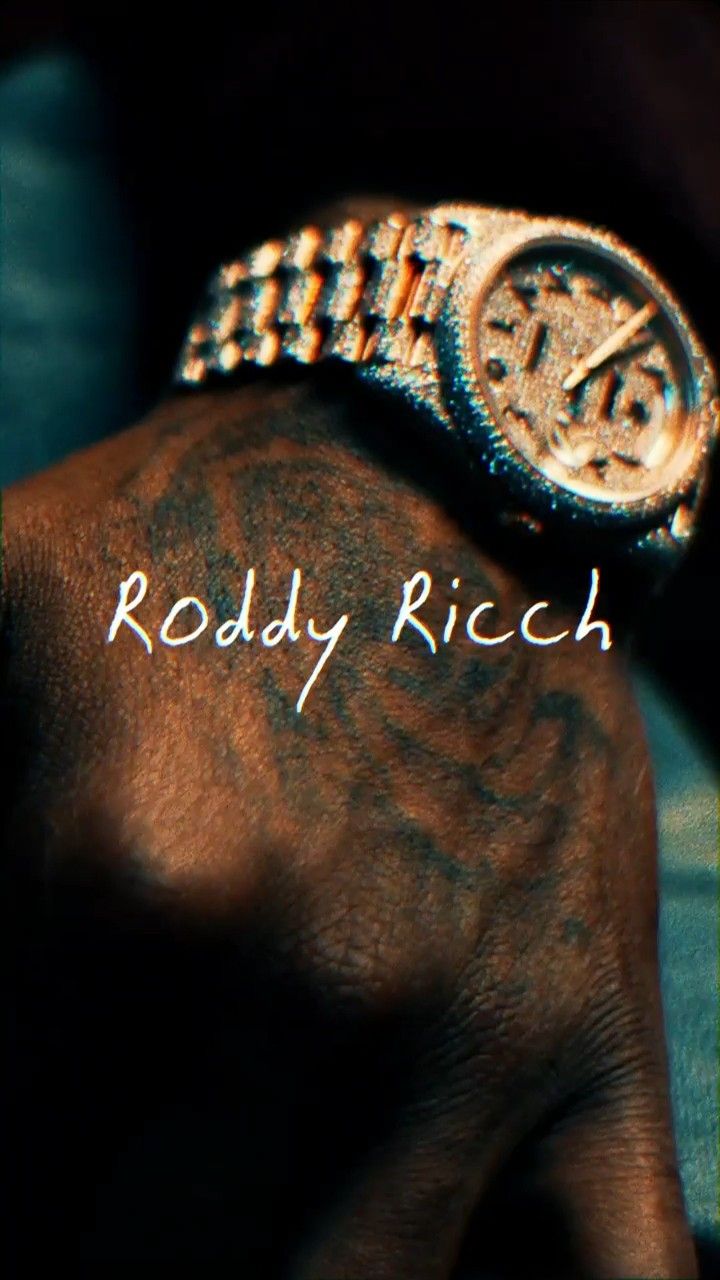 a hand with a watch on it and the words roddy rich written in white ink