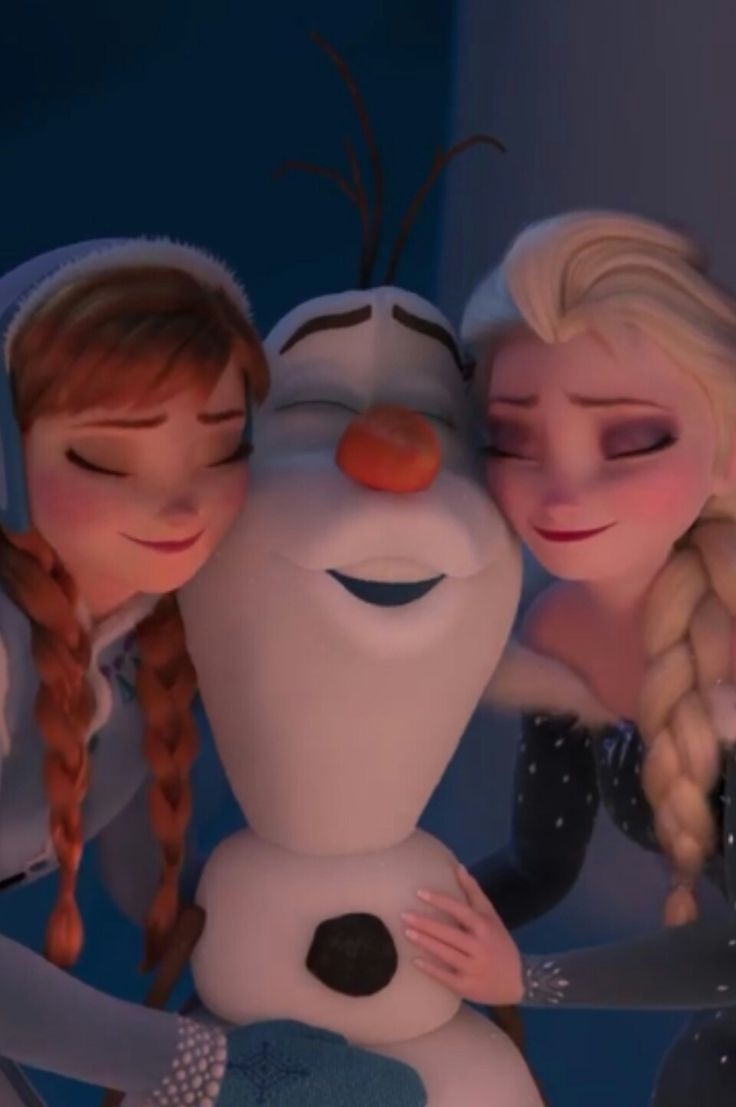 two frozen princesses hugging each other in front of a snowman