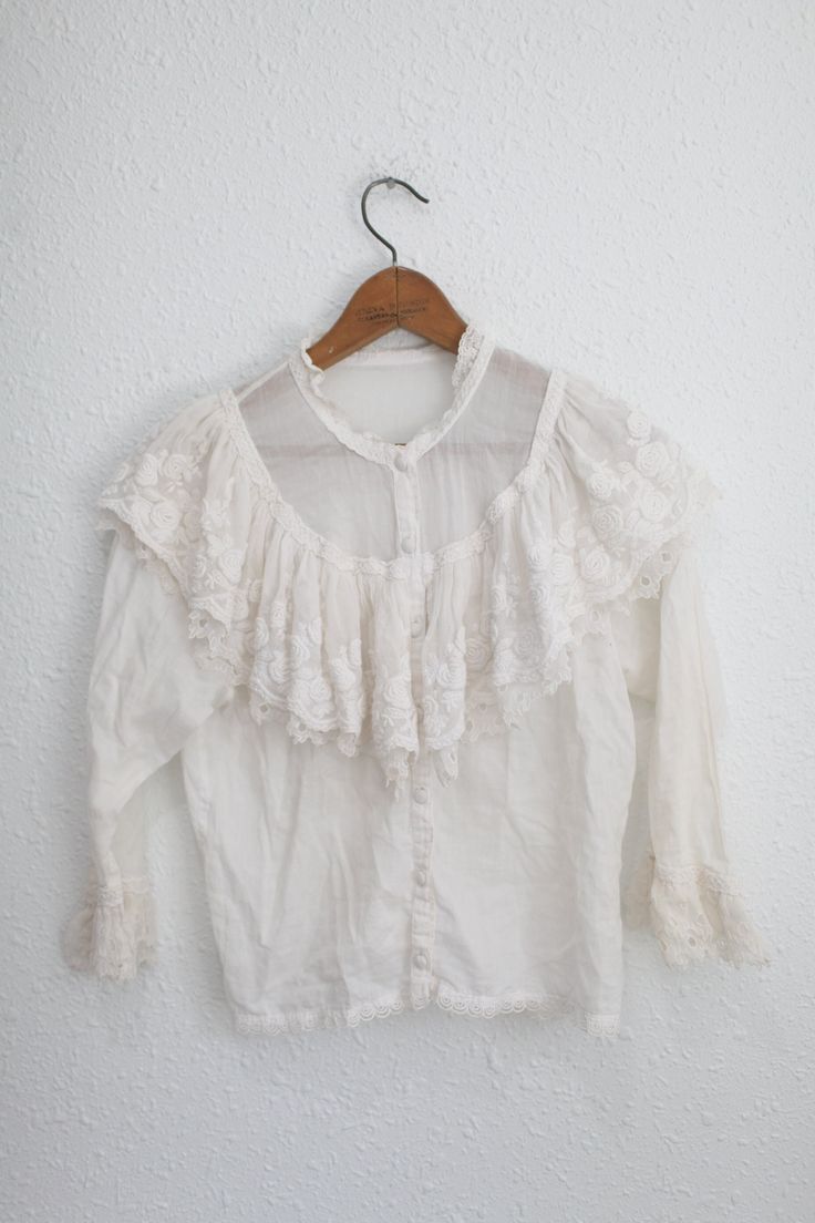 "material: cotton & lace used vintage condition.  shoulders:14 1/2 \" approx pit to pit:19 1/2\" sleeve:19\" length:21\"" Vintage White Lace Top For Spring, Lace Tops With Ruffled Collar For Daywear, Lace Top With Ruffled Collar For Daywear, Vintage Lace Patchwork Top For Spring, Vintage Lace Blouse With Ruffled Collar, Spring Vintage Lace Top With Lace Trim, Vintage Lace Top With Lace Trim For Spring, Fitted Cotton Lace Top With Ruffles, Vintage Lace Top With Ruffles