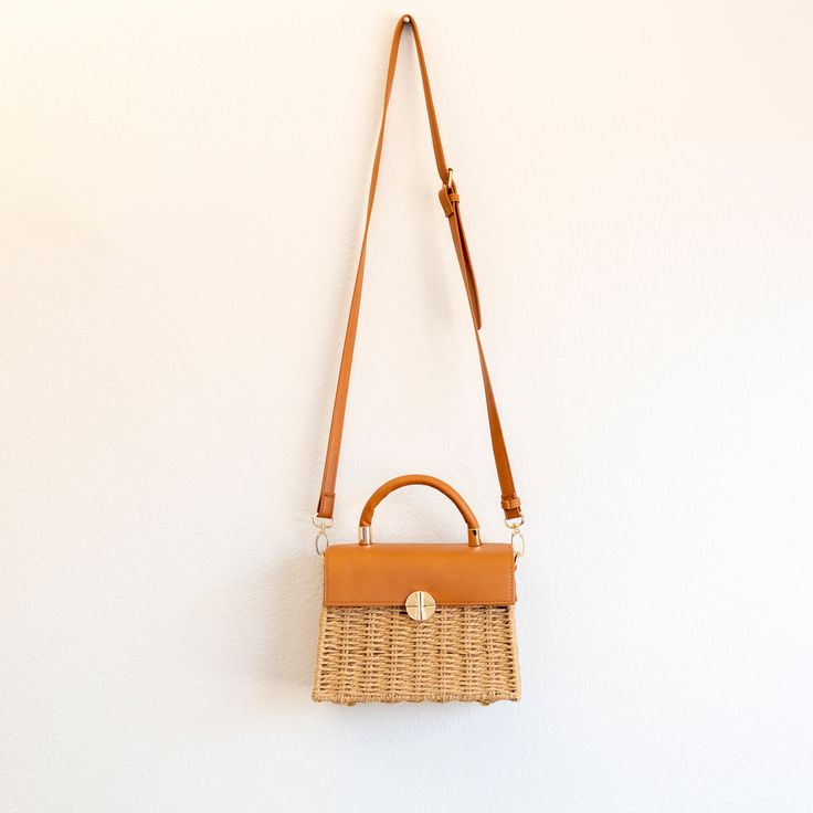 NOW AVAILABLE IN STOCK. FAST SHIPPING FROM LOS ANGELES. 3-5 DAYS This exquisite Elena Handbags Straw Woven Box Bag featuring a leather flap and trims is a sophisticated addition to any wardrobe. Crafted from natural straw material, its classic style is further enhanced with leather accents for a timelessly elegant look. Perfect for formal occasions or everyday wear. Material: Straw + PU Leather Size: 21cm wide x 24cm tall (8in x 9in) Designer Style ID: 8283 Rectangular Straw Bag With Detachable Strap For Shopping, Brown Square Straw Bag With Detachable Handle, Brown Straw Bag With Detachable Handle, Travel Rectangular Straw Bag With Detachable Strap, Square Straw Bag With Detachable Strap For Travel, Rectangular Natural Straw Bag With Detachable Strap, Beige Square Straw Bag With Detachable Strap, Brown Straw Shoulder Bag With Detachable Handle, Beige Rectangular Box Bag With Braided Handles