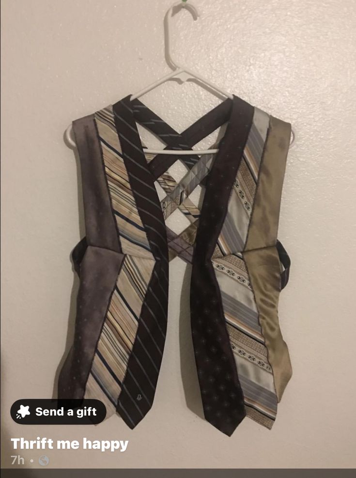 a tie hanging on a wall with the caption send a gift thrift me happy