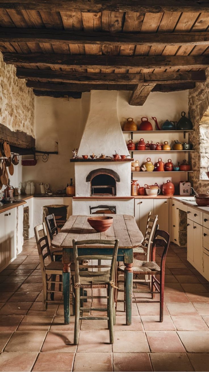 a kitchen with an oven, table and chairs in it next to a stove that is built into the wall