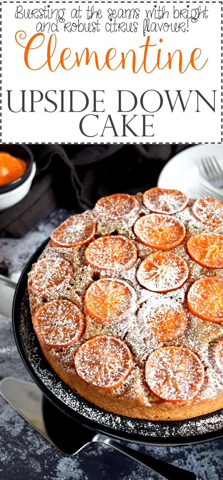 an orange cake with powdered sugar on top and the words clementine upside down cake