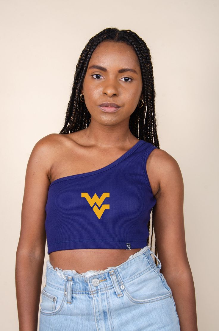 The Senior Top for West Virginia. Classic ribbed-knit tank top with a single shoulder strap. Soft ribbed knit cropped to the waist in a stretch-fit bodycon fit. Comes in white and black. Style it your way! Product details and fit: Bra friendly One Shoulder Cropped Ribbed fabric Slim fitting Stretchy fabric Option to add embroidered logo About the model: Size: S Height: 5’6” Made to order. Made for you ♡ P.S. We'd love to see you repping this style! Don't forget to tag us to be featured *All MTO Michigan Football Outfit, Trendy College Outfits, University Of Michigan, Gameday Outfit, One Shoulder Tops, Knit Crop, Knitted Tank Top, College Outfits, Knit Tanks