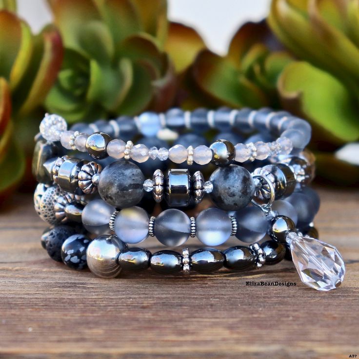 Dark and sultry grays will add that perfect elegance to any outfit. This beauty will look perfect dressed up or with your favorite jeans. Made with memory wire, Labradorite, Czech glass, Hematite and a huge Swarovski crystal. Add your favorite essential oil to the Lava stone for aromatherapy benefits. *One available* *HOW TO USE DIFFUSER BRACELET Add 1 or 2 drops of your favorite essential oil to your lava stone(s).  The lava stone is either black or white with a porous texture.  Allow oil to ab Elegant Silver Stretch Bracelet For Healing, Elegant Gray Stretch Bracelet As Gift, Elegant Gray Bracelets As Gift, Elegant Gray Bracelets For Gift, Elegant Gray Bracelet As Gift, Elegant Gray Bracelet For Gift, Adjustable Gray Gemstone Beads Bracelets, Adjustable Gray Gemstone Beads Bracelet, Elegant Gray Bracelets With Gemstone Beads