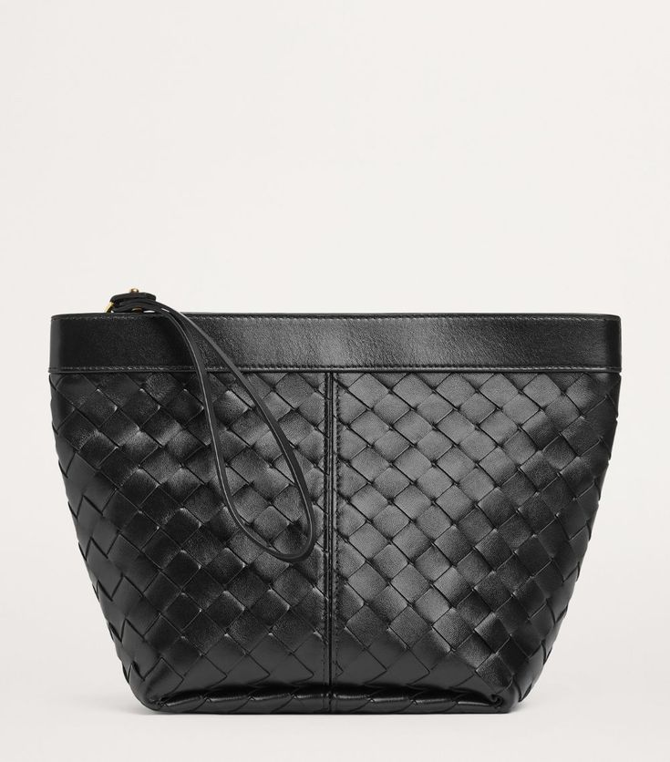 Find BOTTEGA VENETA Medium Leather Prism Pouch on Editorialist. A staple of Bottega Veneta since the '60s, the Intrecciato weave is a consistent and firm reminder of the Italian Houses rich history of craftsmanship. The woven strips of rich calfskin define the Prism pouch, resulting in a refined home for your essentials. Luxury Leather Clutch With Dust Bag, Leather Clutch Pouch With Dust Bag, Everyday Woven Leather Clutch, Designer Woven Leather Clutch, Elegant Woven Leather Clutch For Travel, Luxury Leather Bag With Zipper Pouch, Luxury Black Leather Cosmetic Bag, Luxury Leather Pouch Clutch, Luxury Clutch With Leather Lining