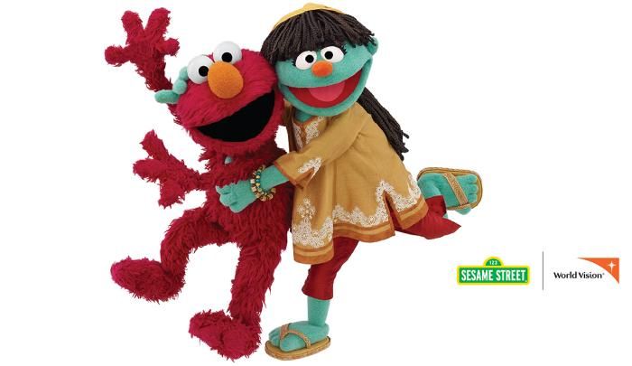 the sesame street characters are hugging each other