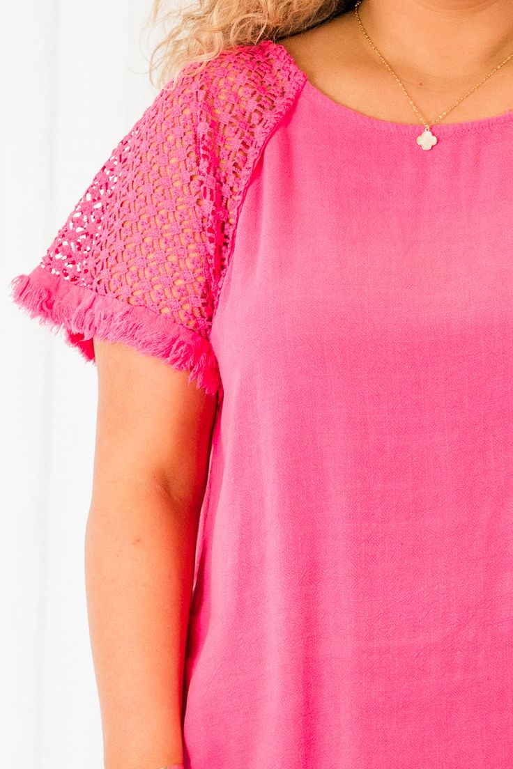 Because we know that you will love this top as much as we do! This top, in bold hot pink, features a unique frayed hemline and delicate crochet detailing! Elevate your style with this eye-catching piece and stand out from the crowd! Perfect for adding a pop of color to your wardrobe! 55% Linen, 45% Cotton Short Sleeve Tops With Crochet Trim For Spring, Spring Top With Crochet Trim And Short Sleeves, Spring Tops With Crochet Trim And Short Sleeves, Spring Short Sleeve Tops With Fringe, Beach Tops With Frayed Hem And Short Sleeves, Short Sleeve Beach Tops With Frayed Hem, Frayed Hem Short Sleeve Tops For Beach, Spring Short Sleeve Top With Cutwork Hem, Casual Summer Blouse With Cutwork Hem