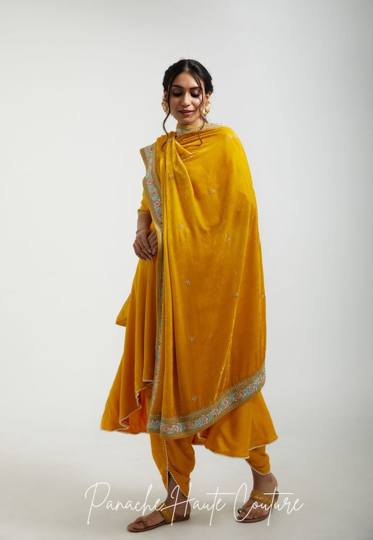 The sunny and cheerful yellow color of the shawl is both bold and refreshing, making it a perfect accessory for both formal and casual occasions. The marodi and resham embroidery on the shawl adds texture and depth, making it an eye-catching accessory that is sure to stand out. Styling Tips: When styling a yellow shawl with marodi and resham embroidery, it's important to balance the bold color and intricate design with simpler pieces. Pair it with neutral colors such as black or white to make the yellow color stand out, or pair it with complementary colors such as blue or green for a bright and cheerful look. Brand : Panache Haute Couture (Made in India) Embroidery: Resham and Marodi Fabric: Silk Velvet Customisation: Colour can be customized as per customers' requirements. Please contact Transitional Season Yellow Salwar Kameez With Chikankari Embroidery, Transitional Yellow Chikankari Embroidery Salwar Kameez, Elegant Yellow Salwar Kameez With Resham Embroidery, Yellow Elegant Anarkali Set With Resham Embroidery, Yellow Salwar Kameez With Chikankari Embroidery For Transitional Season, Yellow Unstitched Sharara For Transitional Season, Yellow Traditional Wear With Dupatta For Transitional Season, Elegant Embroidered Yellow Salwar Kameez, Traditional Yellow Salwar Kameez For Transitional Season