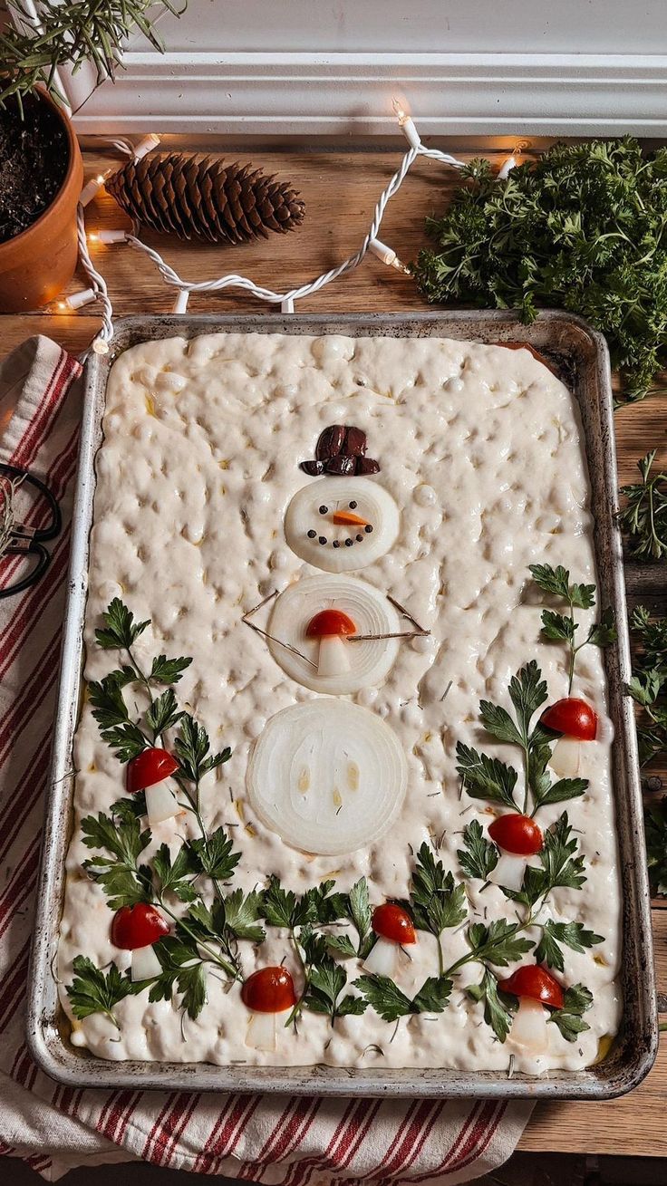 a pan filled with frosting and decorations on top of a table