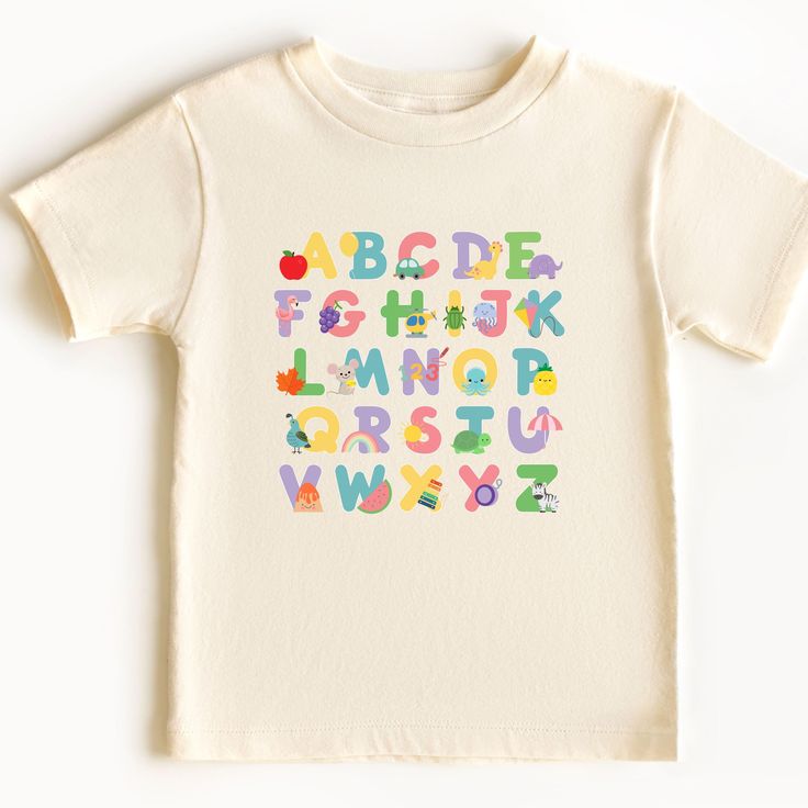 Head back to school in style while learning your letters and letter sounds in this super cute ABC tee! Uplift any child's wardrobe with a custom kid's t-shirt. The Bella Canvas short sleeve tee for toddlers is a 100% Airlume combed and ring-spun cotton jersey with a tear-away label for extra comfort. Choose your favorite color out of a big variety, and make unique staples that toddlers will happily wear every day.  .: 100% airlume combed and ring-spun cotton (fiber content varies for different c Cute Letter Print T-shirt For Playtime, Playful T-shirt For Back To School, Cute Multicolor T-shirt With Name Print, Playful Funny Print T-shirt For School, Multicolor Letter Print T-shirt For School Events, Playful Graphic Print T-shirt For Daycare, Cotton Short Sleeve T-shirt For Playdate, Name Print Short Sleeve T-shirt For Playtime, Short Sleeve T-shirt With Name Print For Playtime