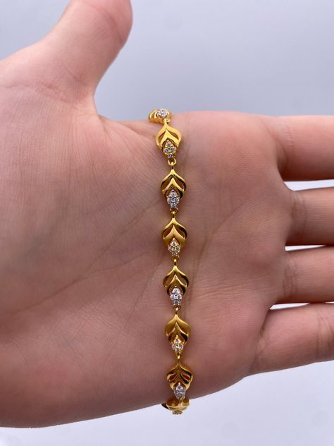 A Beautiful & Dainty 22ct / 22K Yellow Gold & Cubic Zirconia (CZ) Fancy Bracelet Metal : 22K Gold 916 Gold Weight : 9.2 GramsLength : 7 inch Width : 6.0 mm Packaging : Elegant Box Shipping Free in UK Shipping World Wide : See Policy Payment : PayPal, Credit Card, Bank Transfer Returns Policy : 14 Days Hassle Free Returns for 100% Refund To try this item Or View More from our collections Please Visit Our Showroom at North west London . Bracelets Gold Design For Women, Gold Bracelets Design For Women, Gold Bracelet Simple Design, Good Bracelets For Women, Elegant Gold Bracelet Simple, Braslate Design For Women, Women Bracelets Gold Designs, Bracelets Designs For Women, Chain Bracelet Gold For Women