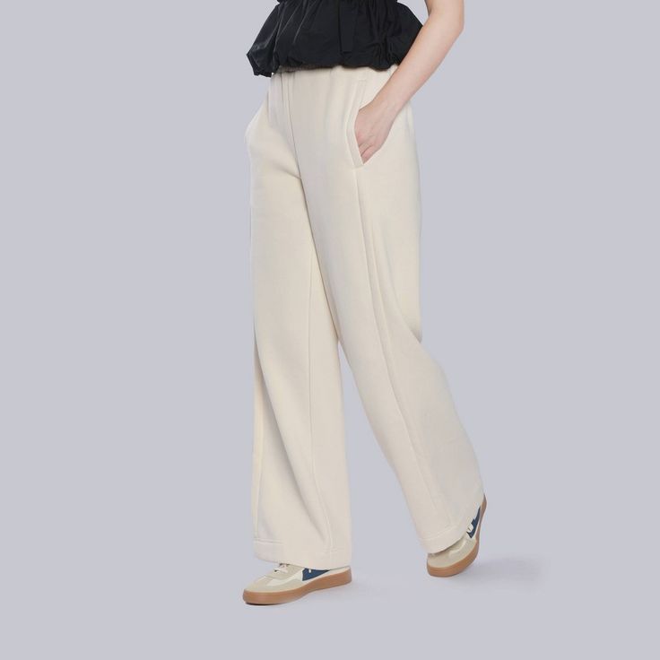 Indulge in the ultimate comfort with our wide-leg sweatpants. Crafted from soft fabric, these pants offer a relaxed fit that's both stylish and effortlessly chic. Whether you're lounging at home or running errands, these sweatpants will keep you feeling cozy and confident. A New Day™: Style that goes wherever you do. Versatile Full-length Relaxed Fit Sweatpants, White Full-length Leisure Pants, Wide-leg Sweatpants For Leisure In Spring, Versatile Wide Leg Sweatpants For Everyday, Solid Color Wide Leg Pants For Spring Leisure, Wide-leg Sweatpants For Spring Leisure, Spring Solid Color Wide Leg Leisure Pants, Spring Wide-leg Sweatpants For Leisure, High-waisted Pants For Leisure