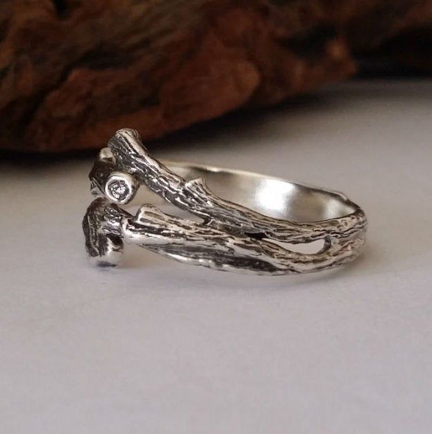 Men's Wedding Band cast in solid Sterling Silver. Custom Jewelry I wanted to hand sculpt a truly unique wedding band that steps away from the basic branch wedding band. I wanted this band to have a ton of character as if you look up into the sky and saw two branches coming together and touching each other to create a bond...I wanted something unique for the guys! This is a design is perfect for the men, being a low profile ring but can also make a wonderful band for the ladies. Branch Ring Mater Rustic Ring For Anniversary, Rustic Silver Jewelry For Wedding, Rustic Anniversary Jewelry Ring, Nature-inspired Sterling Silver Wedding Rings, Nature-inspired Sterling Silver Wedding Jewelry, Nature-inspired Stackable Wedding Jewelry, Rustic Hand Forged Wedding Rings, Nature-inspired Ring For Wedding And Anniversary, Rustic Hand Forged Rings For Anniversary