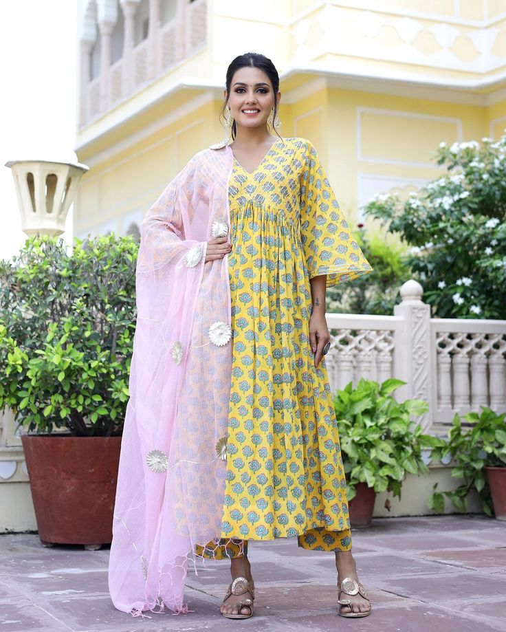 Cotton Yellow Hand Block Print Anarkali Kurta Set - Ria Fashions Yellow Cotton Palazzo Set With Dupatta, Yellow Anarkali Set With Printed Motifs And Long Sleeves, Yellow Anarkali Set With Straight Kurta And Printed Motifs, Anarkali Style Palazzo Set With Block Print, Yellow Mulmul Anarkali Set With Gota Work, Yellow Block Print Mulmul Sets, Yellow Anarkali Set With Printed Motifs, Yellow Anarkali Set With Gota Work In Mulmul, Summer Anarkali Palazzo Set With Cutdana