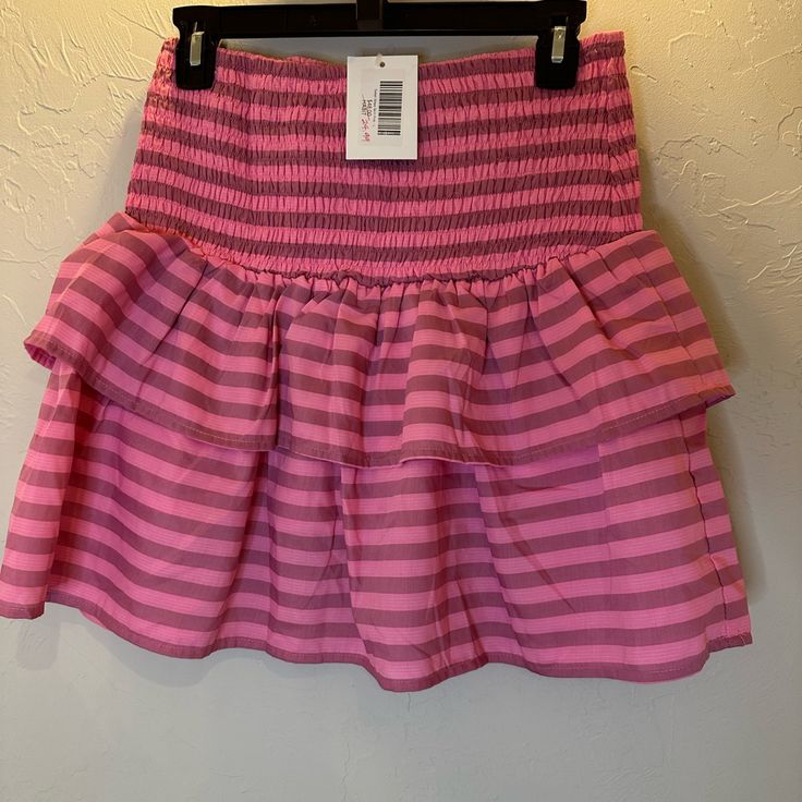 Striped Skirt New With Tags Size Large Trendy Pink Ruffled Skort, Pink Lined Skirt Bottoms For Day Out, Trendy Pink Ruffled Mini Skirt, Chic Pink Skirt With Elastic Waistband, Chic Pink Relaxed Skort, Chic Striped Skort For Spring, Pink Skort For Spring Vacation, Pink Skirted Bottoms For Day Out, Pink Skirted Skort For Vacation