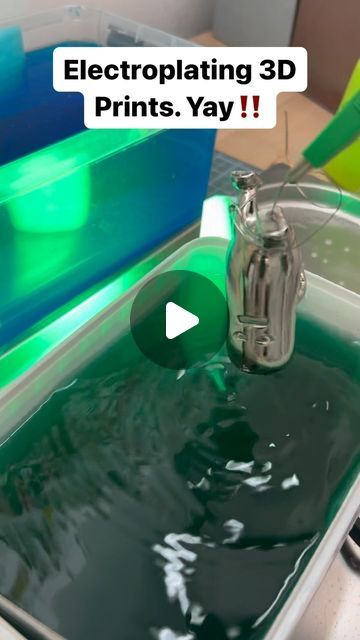 a machine that is pouring green liquid into a sink with the words, electroplating 3d prints, yay