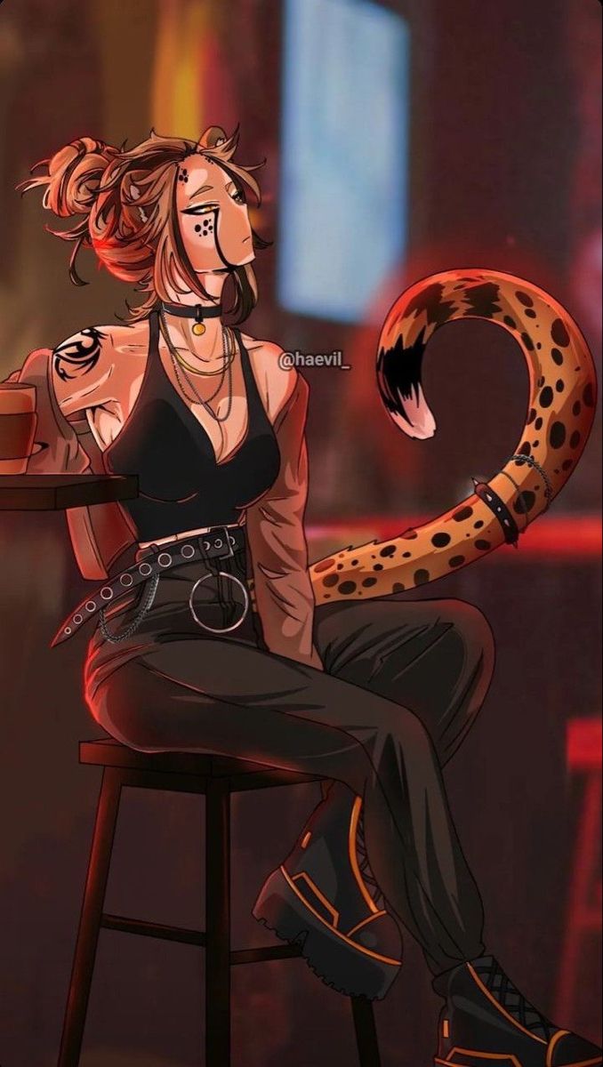 a woman sitting on top of a stool next to a large snake in her hand