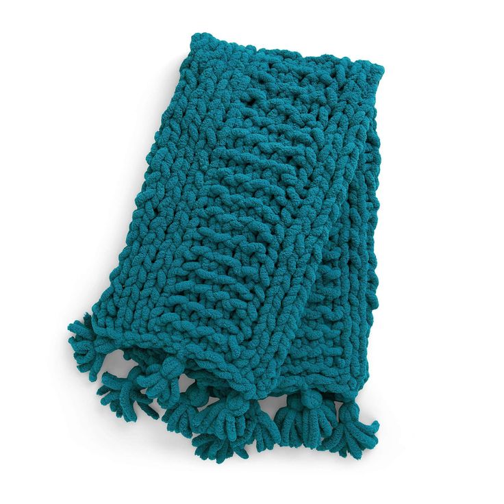 a blue knitted dishcloth on a white background