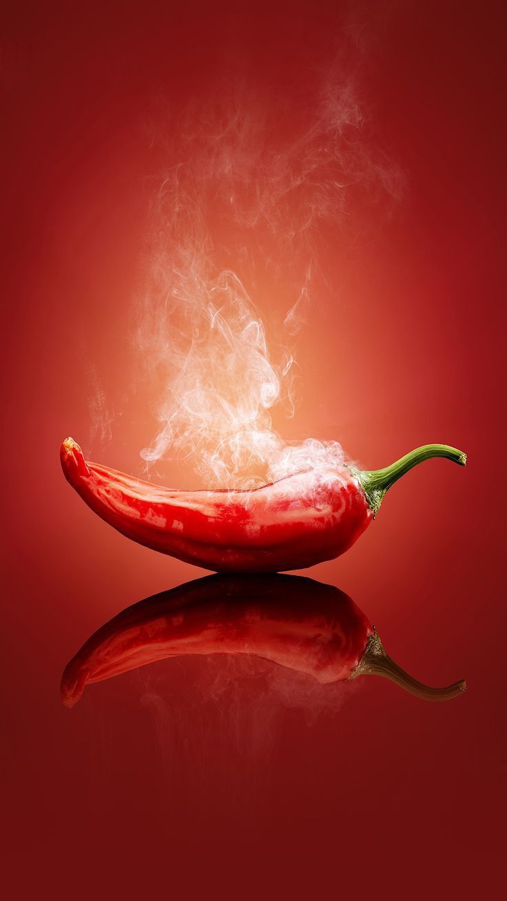 a steaming hot pepper on a red background