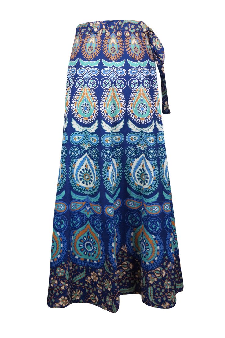 This Women Wraparound Paisley Skirt is perfect for any boho-chic occasion. Crafted with handloom cotton fabric, it features a unique tribal print in striking sea blue hues, and a innovative wraparound style that adds an extra dimension to any wardrobe. One size fits most. SML This Maxi Cotton Wrap Skirt is a unique and stylish way to make a statement. Handmade in handloom cotton, it's a one-size-fits-all, earth-friendly option that's perfect for barbecues, beach walks, or other special occasions Summer Bohemian Cotton Wrap Skirt, Blue Boho Print Maxi Skirt For Vacation, Bohemian Cotton Wrap Skirt For Summer, Blue Flared Maxi Skirt For Vacation, Bohemian Blue Maxi Skirt For Beach, Blue Boho Print Beach Skirt, Multicolor Bohemian Wrap Skirt For Vacation, Blue Boho Print Maxi Skirt For Festival, Bohemian Multicolor Wrap Skirt For Vacation