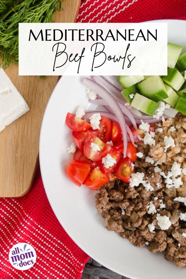 a white plate topped with meat and veggies on top of a red table cloth