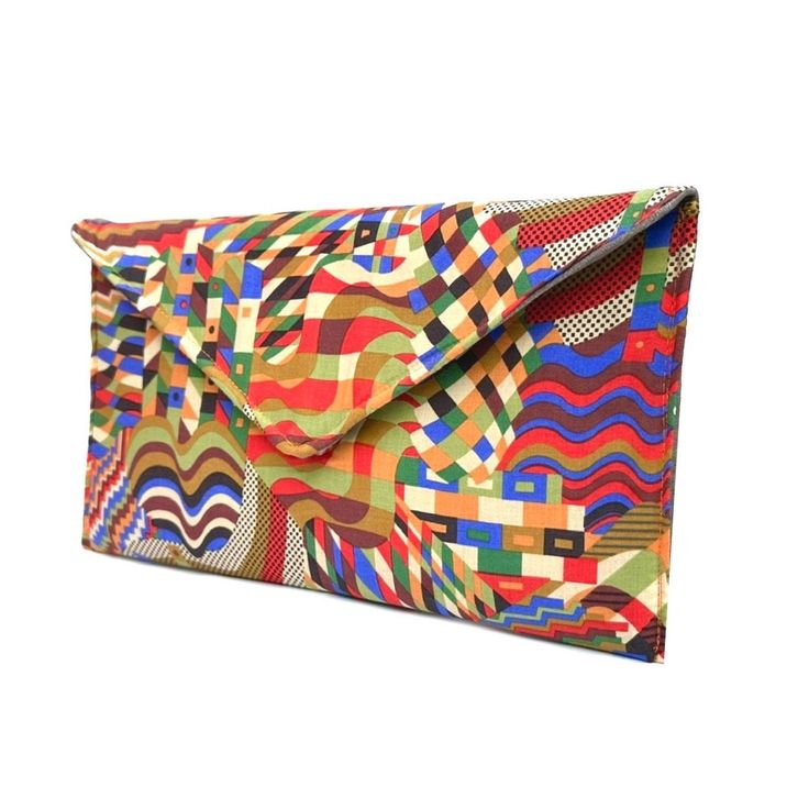 Gorgeous geometric slim envelope bag.  Use it as a clutch or attach the shoulder strap to wear over your shoulder or as a crossbody - Gold or silver strap or no strap - H:15cm x W:28cm (closed) approximately  - Magnetic closure  Due to different monitor settings, colours may differ slightly from those pictured More colours and designs available here: https://www.etsy.com/uk/listing/1537782617/ https://www.etsy.com/uk/listing/1446426249/ https://www.etsy.com/uk/listing/1173605859/ Modern Envelope Bag With Card Slots, Trendy Rectangular Clutch With Zipper Pouch, Modern Clutch With Magnetic Closure For Daily Use, Retro Pouch Clutch For Daily Use, Modern Pouch Clutch With Magnetic Closure, Retro Clutch For Daily Use, Modern Multicolor Rectangular Wallets, Chic Multicolor Clutch With Removable Pouch, Trendy Multicolor Travel Clutch