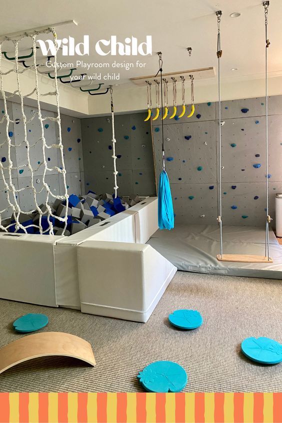 a child's playroom with swings and climbing wall in the background is an advertisement for wild child