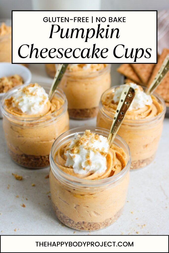 pumpkin cheesecake cups with whipped cream and graham crackers on the side, in small glass jars