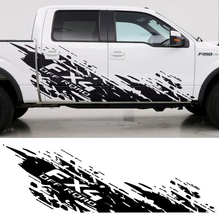 a white truck with black paint splattered on it