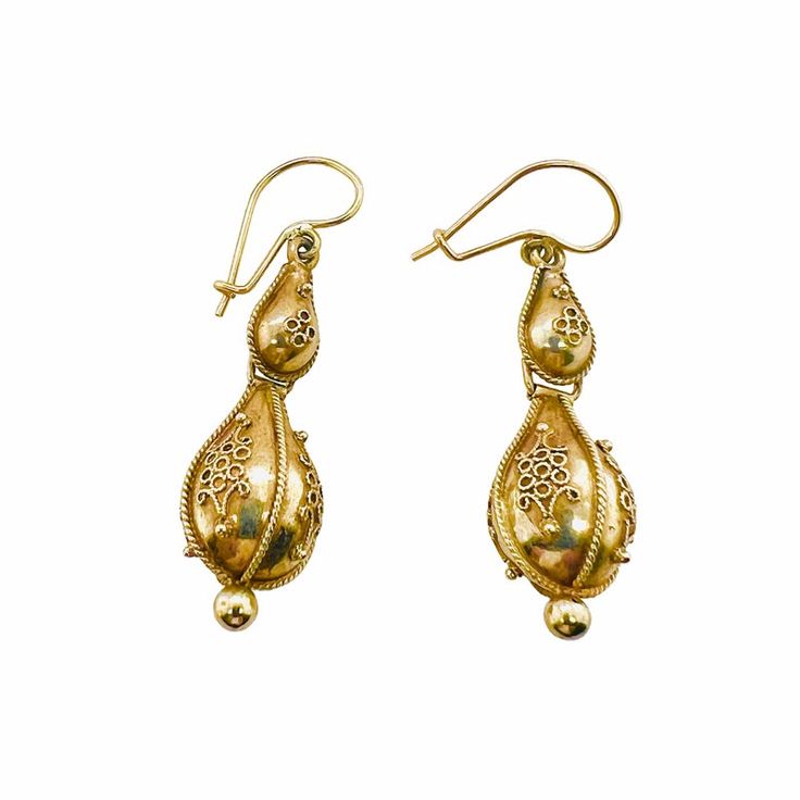 This is part of Chairish’s Fine Jewelry assortment.  A fine Victorian period pair of 14K gold earrings with French wires and hooks for pierced ears. The earrings have Etruscan beadwork applied to both the top and the bottom drop. They are not marked, but test 14K. Condition is excellent.  Dimensions: Length to top of wire: 1 1/2", Diameter: 1/2", Weight: 3.9 grams Traditional 14k Gold Drop Earrings, Antique Yellow Gold Ceremonial Earrings, Antique Yellow Gold Drop Earrings, Victorian Yellow Gold Drop Earrings, Antique 14k Gold Hallmarked Earrings, Antique Filigree Earrings For Ceremonial Occasions, Victorian Yellow Gold Earrings With Intricate Design, Victorian 14k Gold Filigree Earrings, Vintage 14k Gold Filigree Earrings