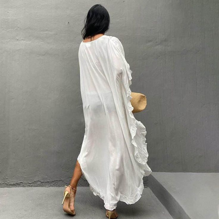 F00149888-100 White Boho Ruffled Dress For Beach, White Ruffled Boho Dress For Beach, White Summer Maxi Dress For Beach Season, White Maxi Dress For Beach Season, White Summer Maxi Beach Dress, Chic Boho Beach Dress With Ruffles, Flowy White Beach Dress With Long Sleeves, White Long Sleeve Summer Beach Dress, White Long Sleeve Dress For Beach Season