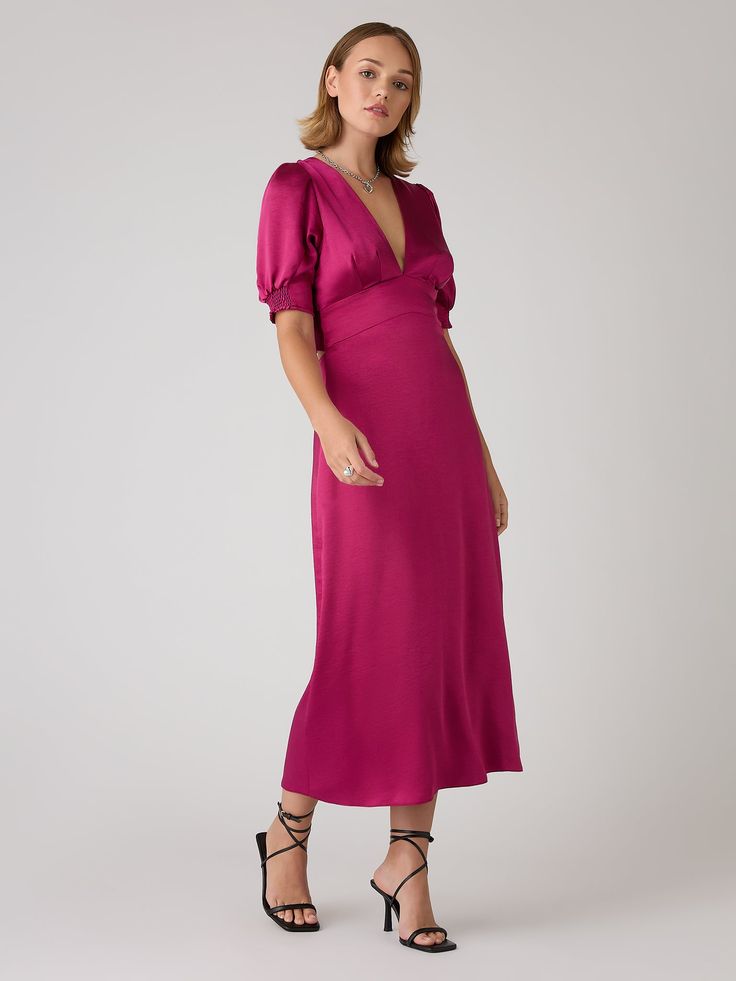 Odette is elegance with an edge. The 3/4 length sleeves are gathered at the bottom to create a feminine silhouette offset with a deep v-neckline. With an open back with sash detail, this dress in deep magenta recycled satin is a date night dream. Spring V-neck Satin Dress For Gala, V-neck Midi Dress With Gathered Sleeves For Night Out, Satin Dress With Gathered Sleeves For Night Out, Spring Gala Satin V-neck Dress, Pink 3/4 Sleeve Evening Dress, Pink Evening Dress With 3/4 Sleeves, Pink V-neck Satin Dress For Formal Occasions, Feminine Midi Dress With Surplice Neckline For Evening, Chic V-neck Satin Dress For Gala