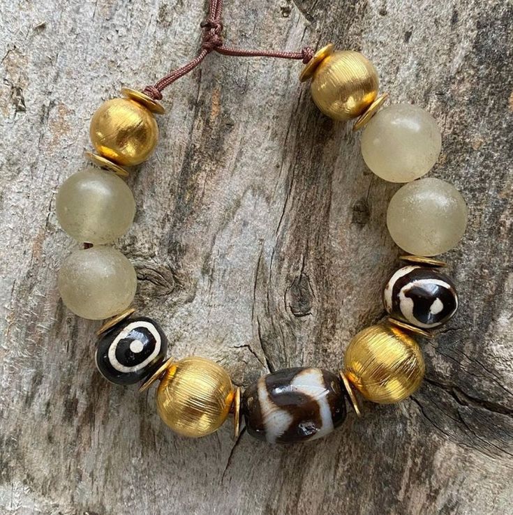 African beads, jade gemstone with golden globe 925 sterling silver Sending requests and suggestions, please feel free to convo me The product will be sent in a gift box with a bag For other inquiries, please visit the shop policies Please visit my shop for other products http://www.etsy.com/shop/SevimsDesign Artisan Gold Beaded Bracelets With Natural Stones, Gold Jade Beaded Bracelets For Spiritual Wear, Gold Jade Beaded Bracelets For Spiritual Purposes, Spiritual Gold Jade Beaded Bracelets, Artisan Gold Bracelets With Polished Beads, Gold Artisan Bracelet With Polished Beads, Handmade Spiritual Rondelle Beads, Spiritual Handmade Rondelle Beads, Amulet Style Bracelet With Round Beads As Gift