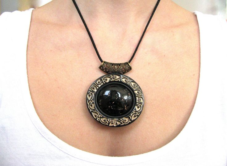 Gothic necklace, Black necklace gift, Victorian jewelry necklace, Black jewelry for women, Statement necklace, Statement jewelry gift Beautiful Black large Statement Victorian style necklace I made from polymer clay . I used bronze mineral pigments to made the frame of the necklace and the imitation of the black stone is with lines  in gold color. The necklace is with bronze filigree metal bail. Size : Pendant height  6 cm / 2.36'' Pendant width  6.2 cm / 2.44'' Necklace length  59 cm / 23.22'' Black Polymer Clay Jewelry Gift, Elegant Polymer Clay Necklaces For Gifts, Elegant Polymer Clay Necklace For Gifts, Handmade Black Resin Necklaces, Unique Black Resin Jewelry, Handmade Black Resin Necklace, Black Bohemian Polymer Clay Jewelry, Elegant Handmade Polymer Clay Necklaces, Bohemian Black Jewelry Made Of Polymer Clay