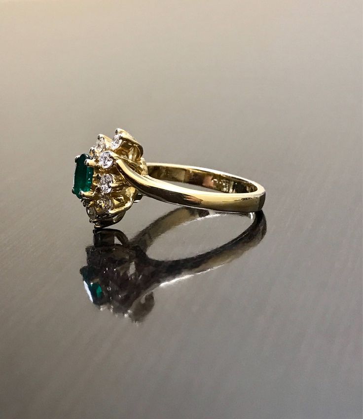 DeKara Designs Classic Handmade Art Deco Oval Emerald and Diamond Ring. This ring was entirely handmade by my father in the 1980's, anyone lucky enough to buy this ring will truly appreciate the workmanship and the beauty of this piece of art. Metal- 14K Yellow Gold, .583 Stones- 1 Oval Natural Green Emerald 0.45 Carats, 10 Round Diamonds, G-H color VS1 Clarity, 0.50 Carats. This ring is entirely put together piece by piece, and all the stones are carefully and expertly prong set. The ring is a Collectible Emerald Ring With Prong Setting, Vintage Emerald Diamond Ring With Round Cut, Antique 14k Stamped Emerald Anniversary Ring, Vintage Gold Emerald Wedding Ring, Antique 14k Stamped Birthstone Wedding Ring, Vintage Diamond Birthstone Ring For Wedding, Vintage Gold Emerald Ring With Brilliant Cut, Vintage Hallmarked Emerald Ring With Round Cut, Victorian 14k Stamped Emerald Ring For Anniversary