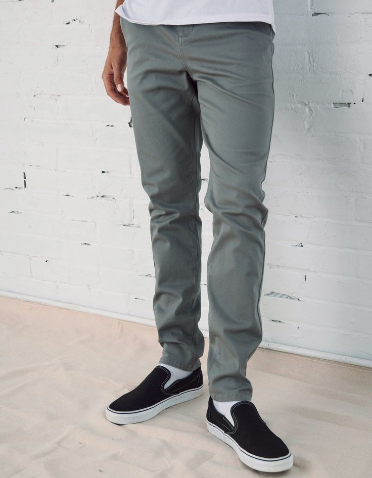 RSQ Skinny Chinos. Formerly known as the "Seattle Skinny Taper Chino Pants". Slant front pockets with welt back pockets and additional decorative pocket with RSQ tag at back left pocket. Approx leg opening: 13.5"(34cm). 97% cotton/3% spandex. Machine wash. Imported.Model is 6'2.5" wearing a size 31x32.Approx outseam: 41"Approx leg opening: 13.5" Spring Slim Fit Chinos, Casual Pants With Button Zip Fly, Casual Full-length Pants With Button Zip Fly, Gray Casual Pants For Business Casual, Casual Full Length Buttoned Pants, Casual Fitted Full-length Chinos, Casual Full Length Summer Chinos, Casual Full Length Pants With Buttons, Casual Fitted Pants With Buttons