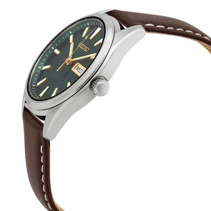 Stainless steel case with a brown leather strap. Fixed stainless steel bezel. Green dial with luminous gold-tone hands and index hour markers. Minute markers around the outer rim. Dial Type: Analog. Luminescent hands and markers. Day of the week and date display at the 3 o'clock position. Quartz movement. Scratch resistant sapphire crystal. Pull / push crown. Solid case back. Round case shape. Case size: 40.2 mm. Case thickness: 8.4 mm. Band width: 20 mm. Tang clasp. Water resistant at 100 meter Leather Chronograph Round Watch, Leather Chronograph Watch, Brown Analog Display Watch With Round Dial, Brown Analog Display Watches, Leather Analog Round Watch, Brown Leather Watch With Analog Display, Brown Round Watch With Subdials, Leather Analog Watch, Brown Watch With Subdials