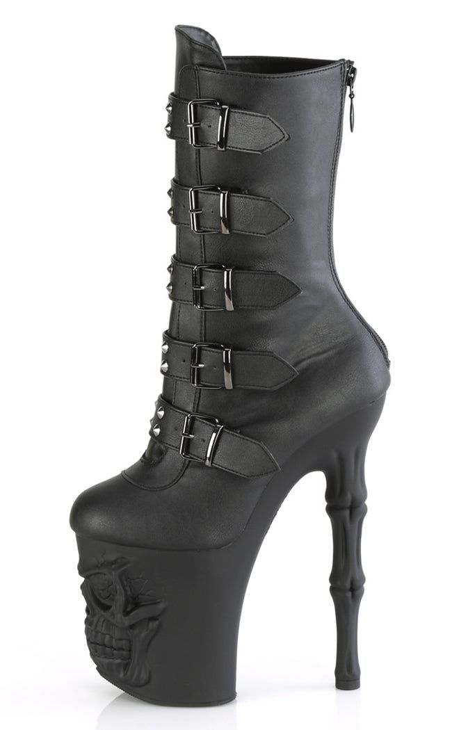 Become yer own reaper in the RAPTURE-1052BK boots! These boots feature a black matte upper that secures with 5 studded buckles and a rear zip. The platforms are the real showstopper, featuring a grinning skull and fingerbone heel in a matte black finish. An absolute must for deadly dancing! The RAPTURE series features an 8" (200mm) heel and a 4" (100mm) platform. Material: 100% vegan PU. US women's sizing-refer to size chart for more info. Black Gothic Platform Boots With Buckle Closure, Gothic Black Platform Boots With Buckle Closure, Gothic Faux Leather Moto Boots For Alternative Fashion, Gothic Black Boots With Spikes, Gothic Black Spiked Platform Boots, Gothic Black Platform Boots With Spikes, Gothic Black Moto Boots With Rivets, Gothic Faux Leather Boots With Rivets, Gothic Style Faux Leather Boots With Rivets