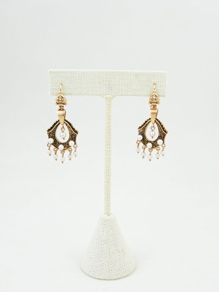 Delicate pearl & gold dangling mini chandelier earrings from around 1920/30’s. 1.5”(h) x 0.75”(w)Marks: 14K Condition: Excellent Antique Formal Dangle Chandelier Earrings, Antique Dangle Chandelier Earrings For Formal Occasions, Formal Brass Dangle Chandelier Earrings, Victorian Teardrop Chandelier Earrings For Formal Occasions, Antique Pearl Drop Jewelry For Evening, Victorian Pearl Earrings For Pierced Ears, Victorian Pearl Drop Jewelry For Evening, Victorian Chandelier Dangle Earrings For Formal Occasions, Antique Chandelier Earrings For Formal Occasions