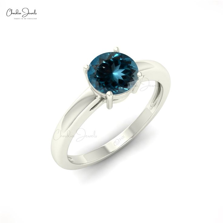 Description This gorgeous London Blue Topaz solitaire ring blends a classic design with a one-of-a-kind gemstone to create a truly stunning ring that will cherish for many years. The solitaire ring has a beautiful 6mm round cut London Blue Topaz in the center that weighs a total of 0.57 carats. London Blue Topaz is a birthstone for December. Rose Gold, Yellow Gold, and White Gold versions of this 14k solid gold ring are available for you. Product Details SKU CJ-R-1349-LBT Product dimension 21.62 Classic Blue Diamond Ring With Brilliant Cut, Classic Blue Sapphire Ring With Round Cut, Classic Blue Brilliant Cut Diamond Ring, Classic Blue Round Cut Diamond Ring, Blue Solitaire Diamond Ring For Promise, Blue Topaz Solitaire Ring Round Cut, Classic Blue Topaz Solitaire Ring, Blue Solitaire Topaz Ring With Round Stone, Blue Solitaire Diamond Promise Ring