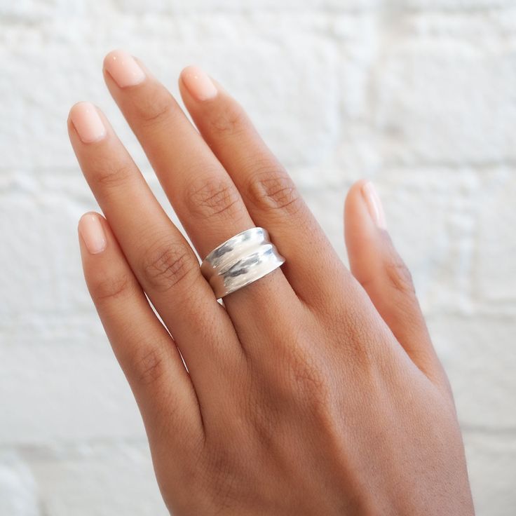 With its graceful rolling mounds, The Hanhoe ring by Ariana Boussard-Reifel is a classic ring with a sculptural feel. A low profile and tapered band make it incredibly comfortable to wear all the time. Metal: Sterling Silver Measurements: Ring height: 2.6mm, Ring width: 12.5-3.8mm Size 7.5 in stock Shipping and Delivery: IN STOCK items will ship within 2 business days Sizes not In Stock will be MADE TO ORDER Please allow 4-5 weeks for delivery All MADE TO ORDER items are final sale Please make s Brass Cuff, Brass Hoops, Brass Ring, Classic Ring, Brass Earrings, Low Profile, Sale Items, Final Sale, Silver Ring