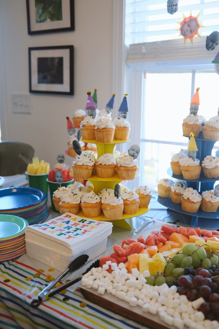 an assortment of cupcakes and desserts on a table