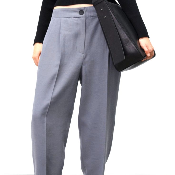 High Waist Pants With Pleats And Front Pockets. Front Zip And Button Closure. Tailored Gray Trousers, Gray Tailored Trousers, Casual Tailored Gray Bottoms, Baggy Gray High-waisted Pants, Gray Baggy High-waisted Pants, Gray Baggy Pants For Workwear, Baggy Ankle-length Dress Pants For Work, Gray High-waisted Pants For Spring, Tailored Gray Straight Pants Bottoms