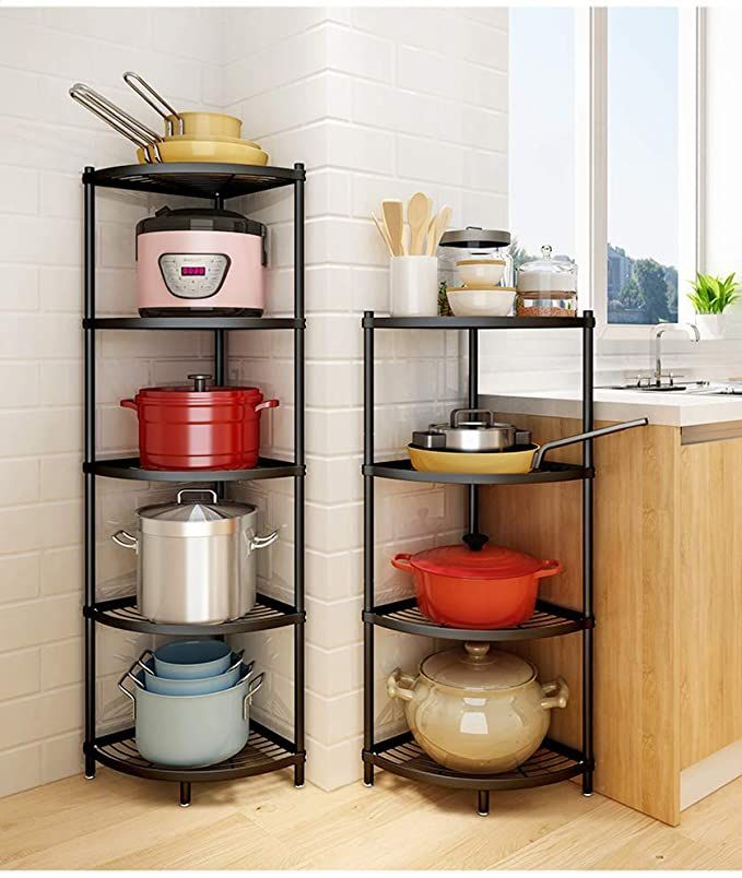 three shelves with pots and pans on them